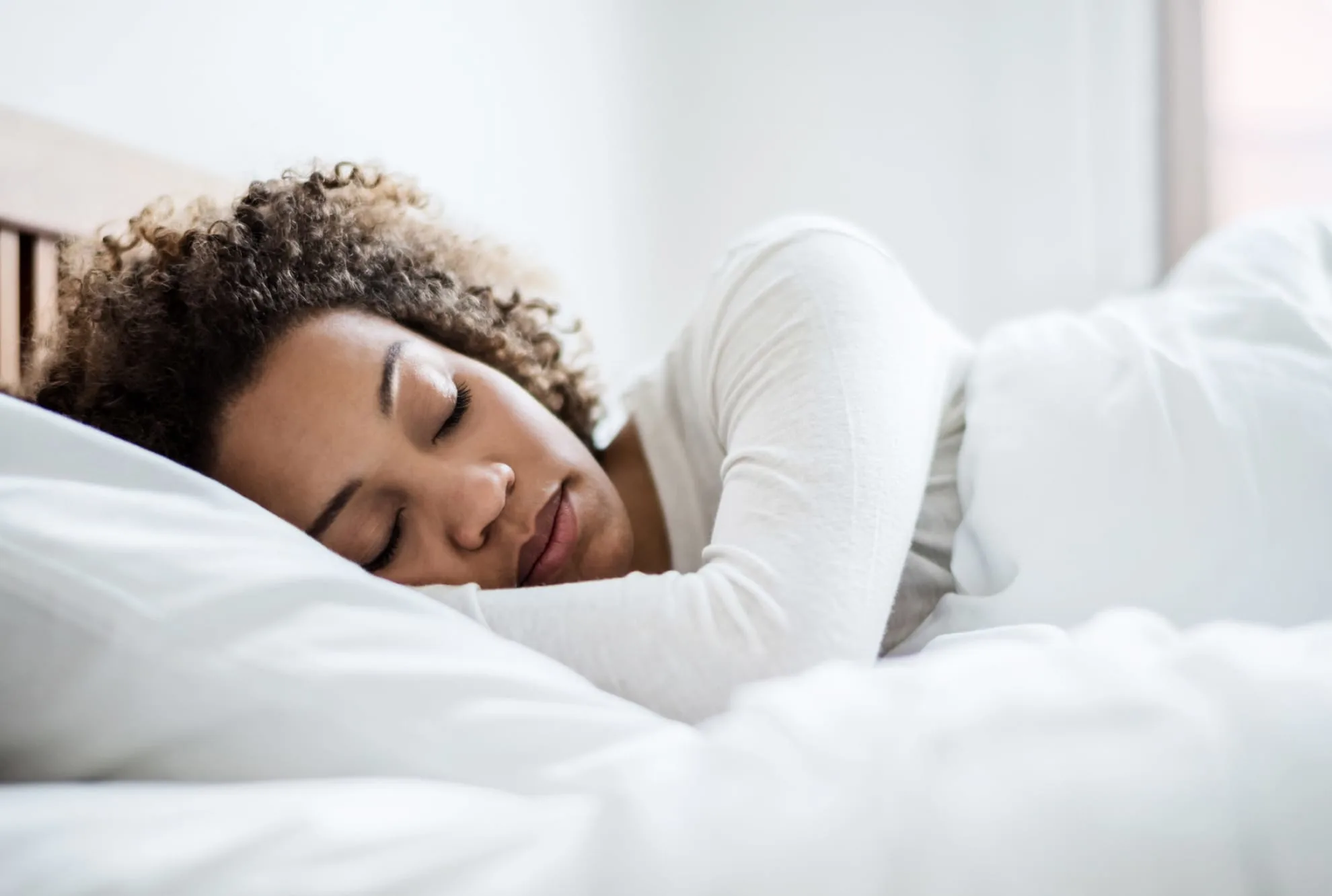 Woman sleeping peacefully in bed